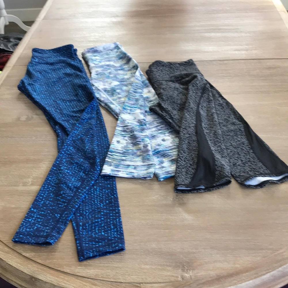 3 pairs of Lululemon workout pants.